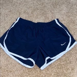 Nike navy blue running shorts.